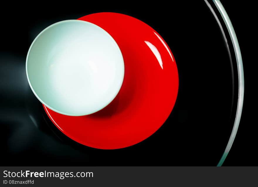 Bright Plates On A Black Table