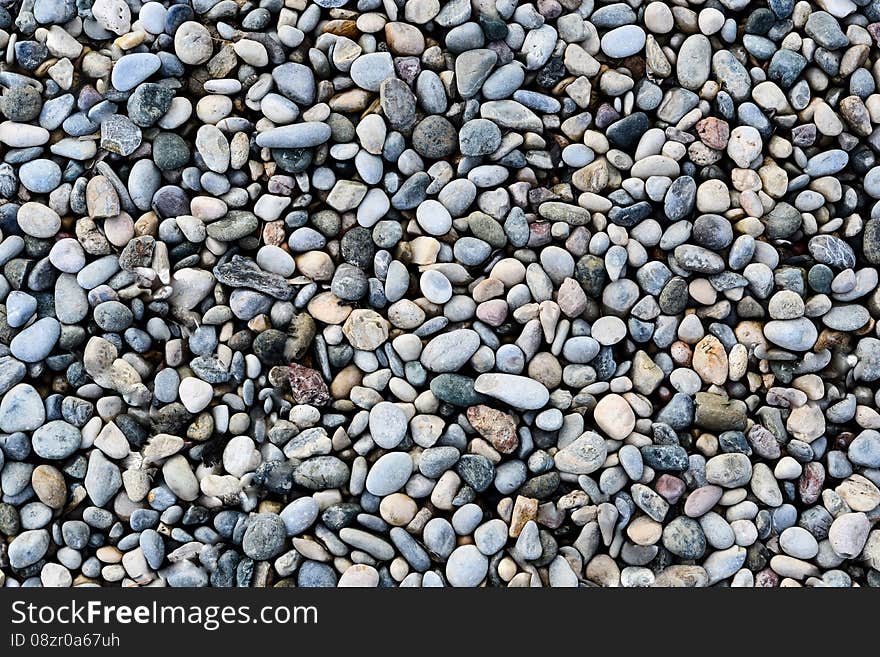 Pebble stones on the ground background texture. Pebble stones on the ground background texture