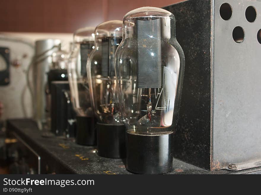 Glass lamps in retro amplifier closeup