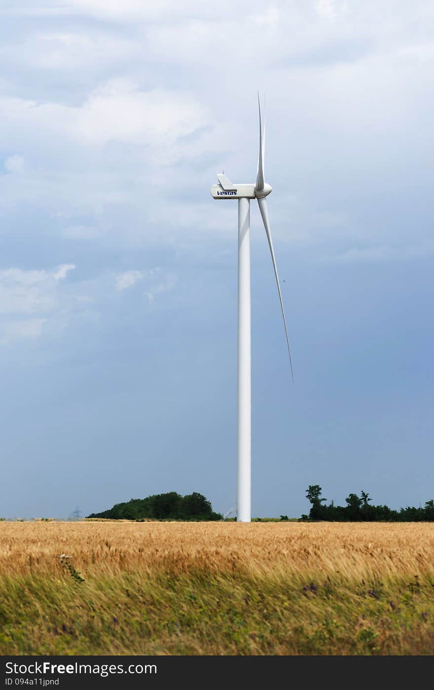 A wind farm in the wide spread wheat field