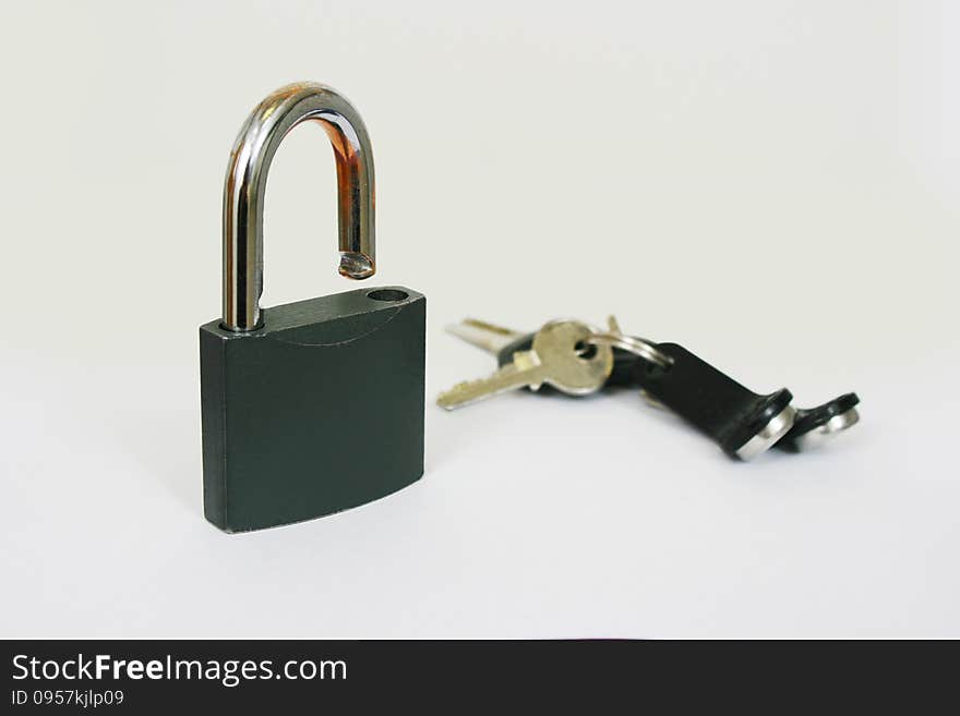 Standing Lock With A Bunch Of Keys On A White Background