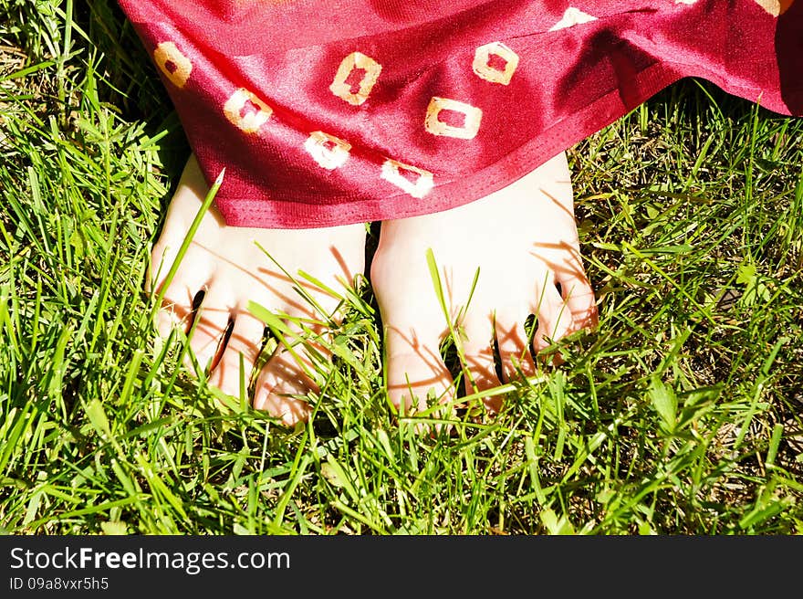 Barefoot girl on grass