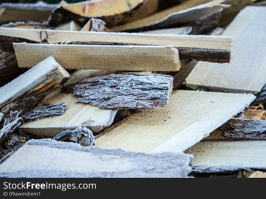 Heap of wood covered with frost. Heap of wood covered with frost.