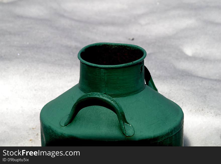 Old Large Milk Can Painted In Green Color In The Snow