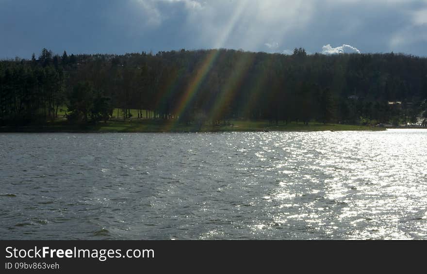 End of the rainbow above the lake