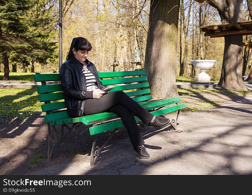 Young beautiful woman holding a tablet