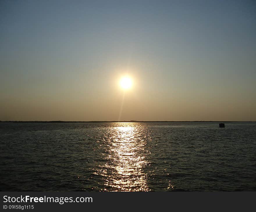 Sunset enveloped the river by the end of the passing day. Sunset enveloped the river by the end of the passing day.