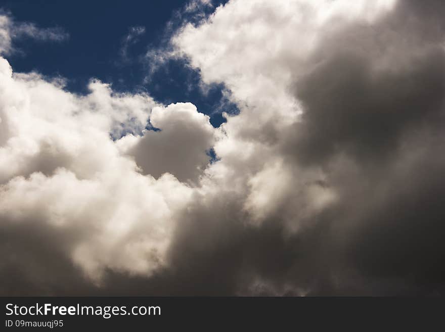 Thick white cloud in the blue sky on sunny day