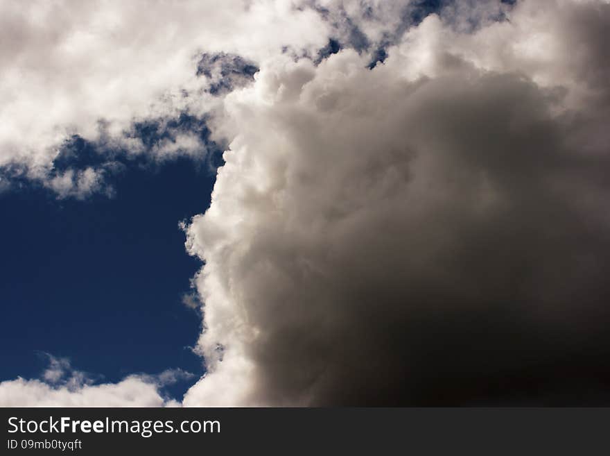 Thick white cloud in the blue sky on sunny day