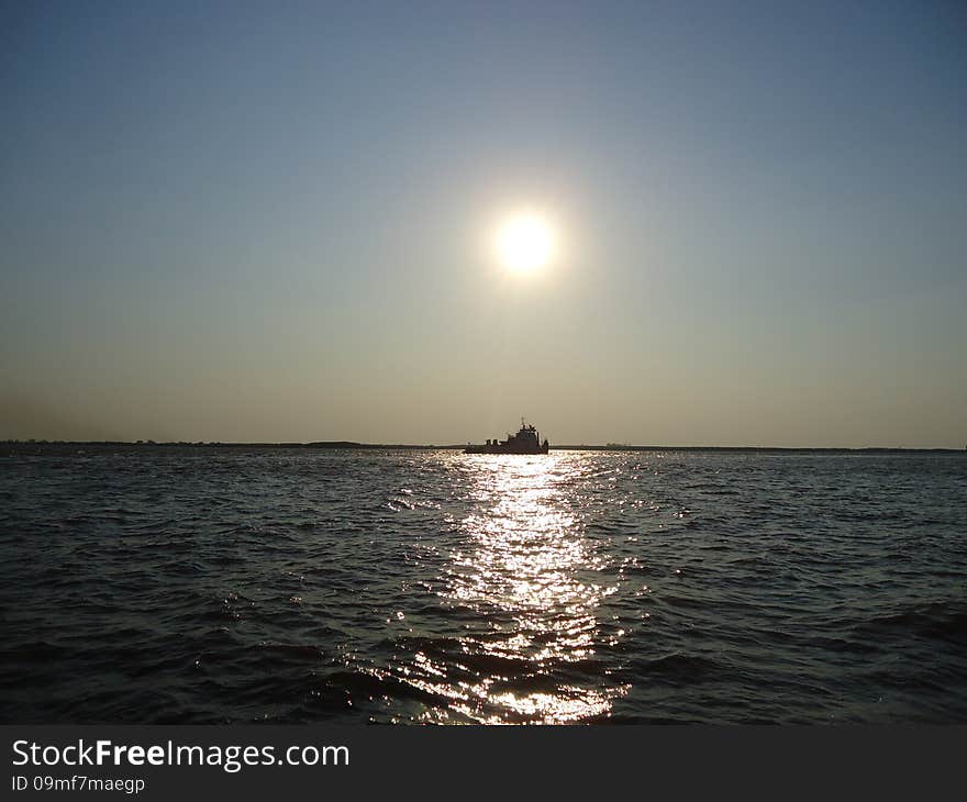 Riverboat on the vast expanse of the river. Riverboat on the vast expanse of the river.