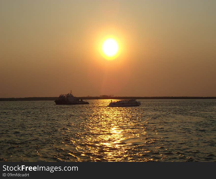 Riverboat on the vast expanse of the river. Riverboat on the vast expanse of the river.