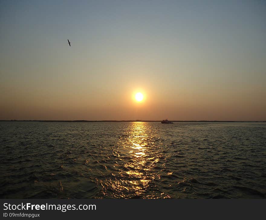 Riverboat on the vast expanse of the river. Riverboat on the vast expanse of the river.