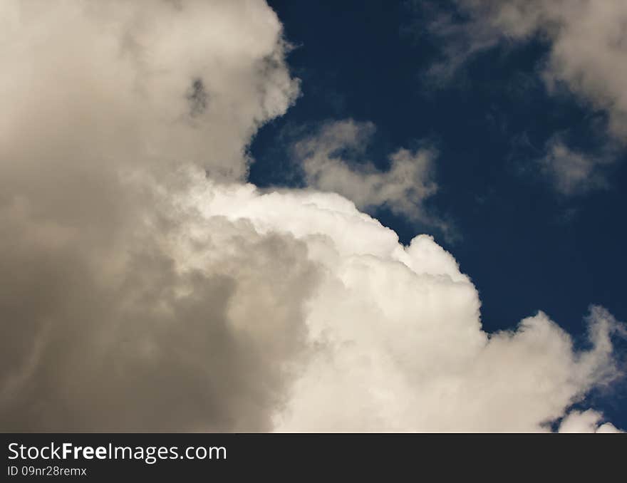 Thick white cloud in the blue sky on sunny day