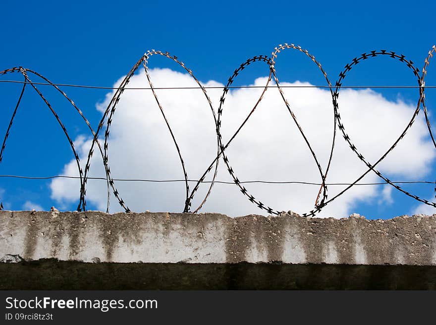 Barbed Wire On Top Of The Concrete Fences