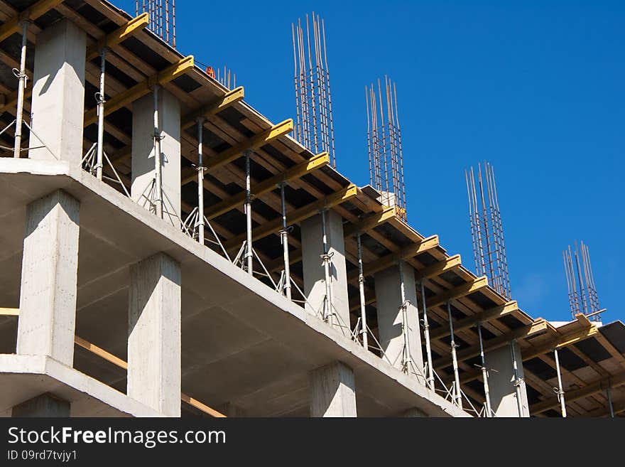 Construction of a multistory building on sunny summer day. Construction of a multistory building on sunny summer day