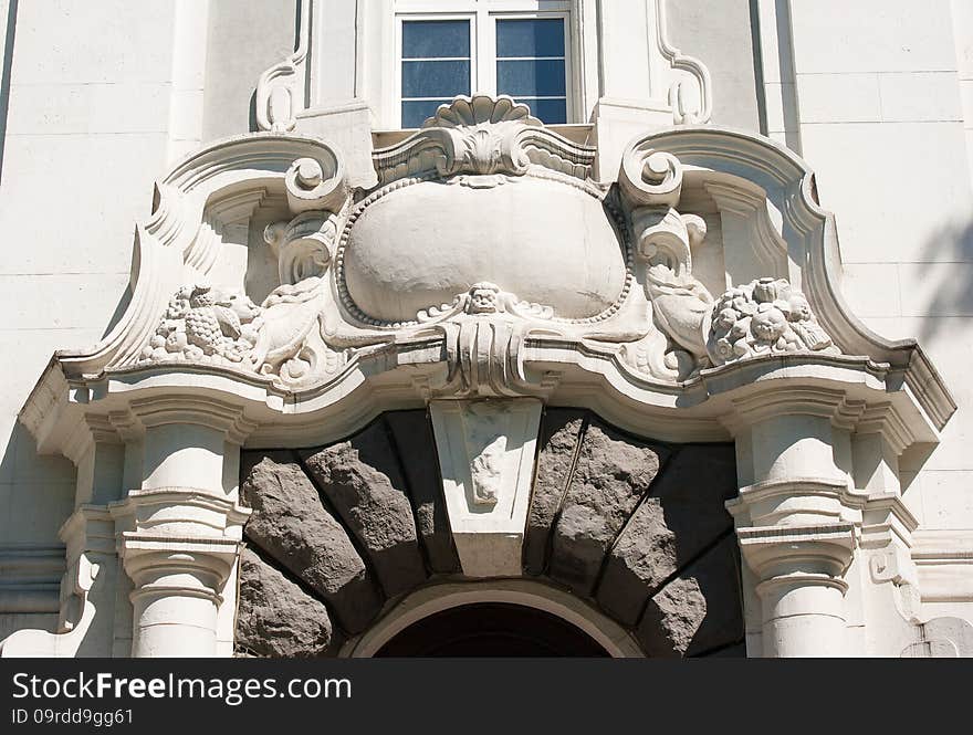 Old bas-relief above the entrance door closeup