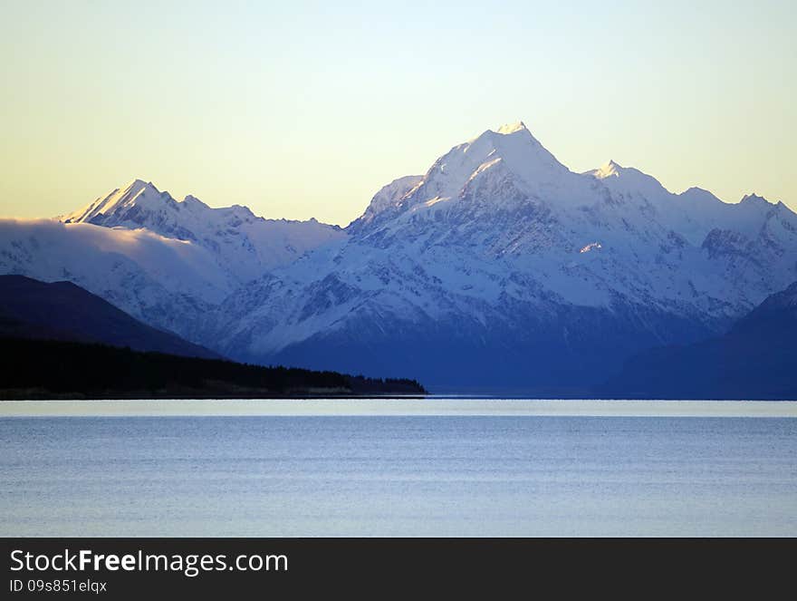 Snow covered Mount Cook peak and mountain range in southern New Zealand, Lake Pukaki. Snow covered Mount Cook peak and mountain range in southern New Zealand, Lake Pukaki