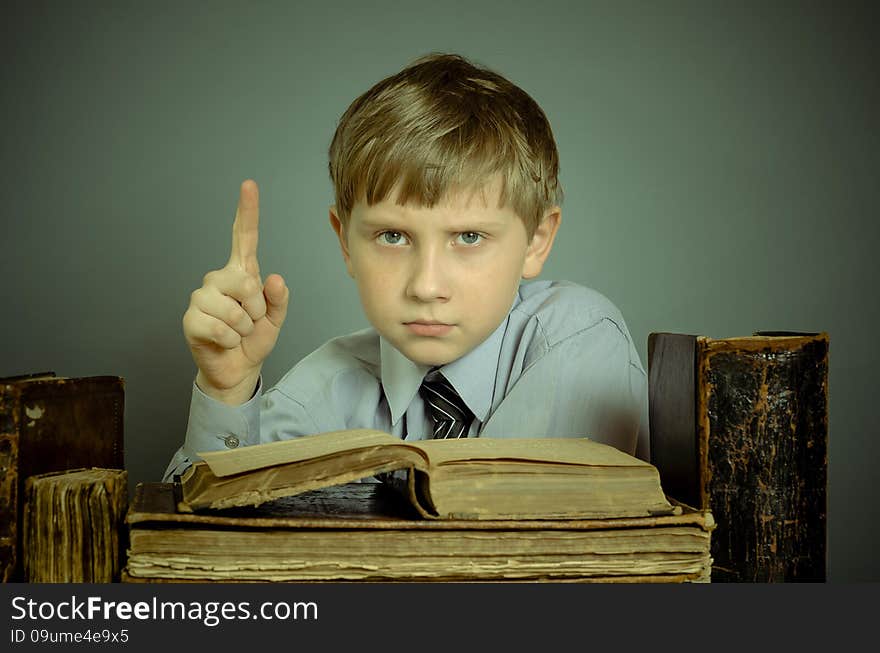 The Boy Spends Time Reading Old Books