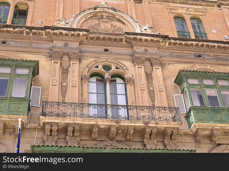 Antique window and balconies of a building in the classical style. Antique window and balconies of a building in the classical style