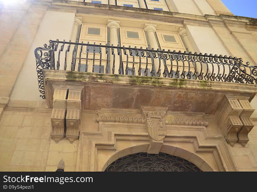 Ancient windows and balconies of a building in the classical style