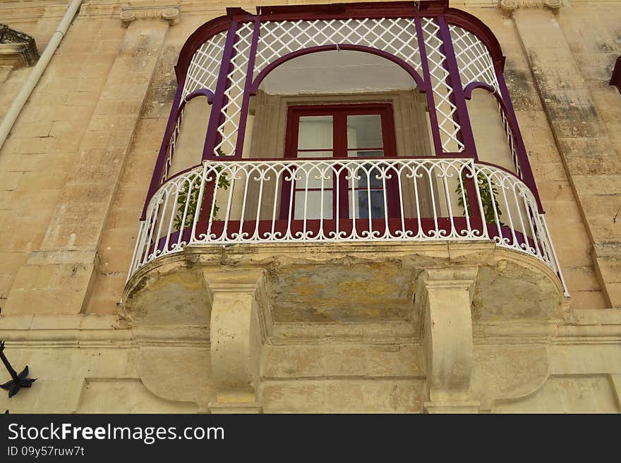 Ancient windows and balconies of a building in the classical style