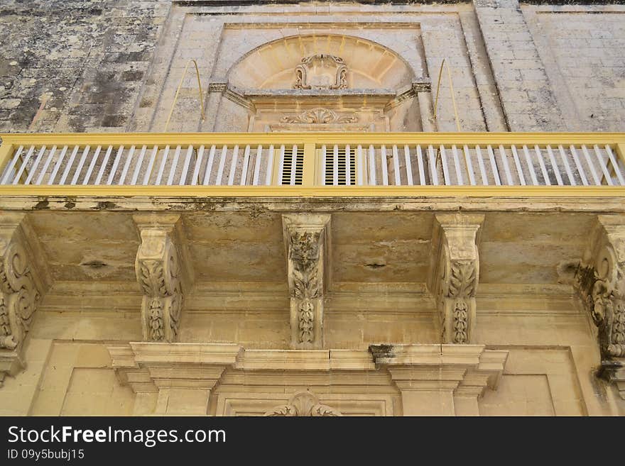 Ancient windows and balconies of a building in the classical style