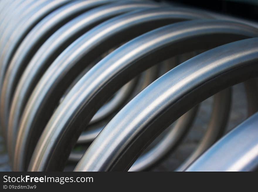 Fragment of large metal spiral as an abstract background outside