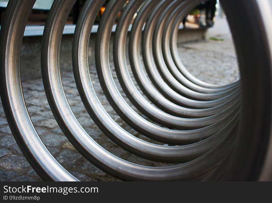 Large metal spiral as an abstract background with perspective outside