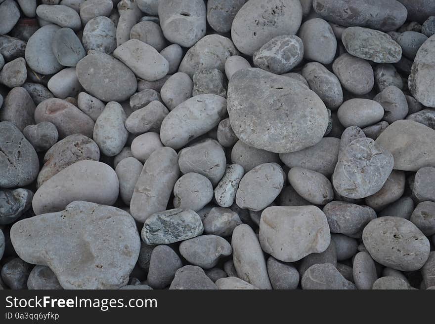 Volcanic pebbles on beach, Taormina, Sicily, Italy