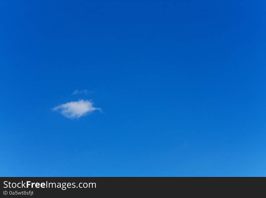 One small cloud in the blue sky