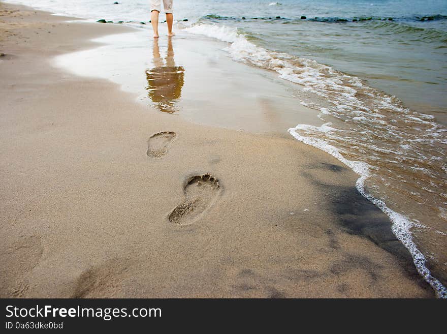 Woman S Footprints On The Seashore