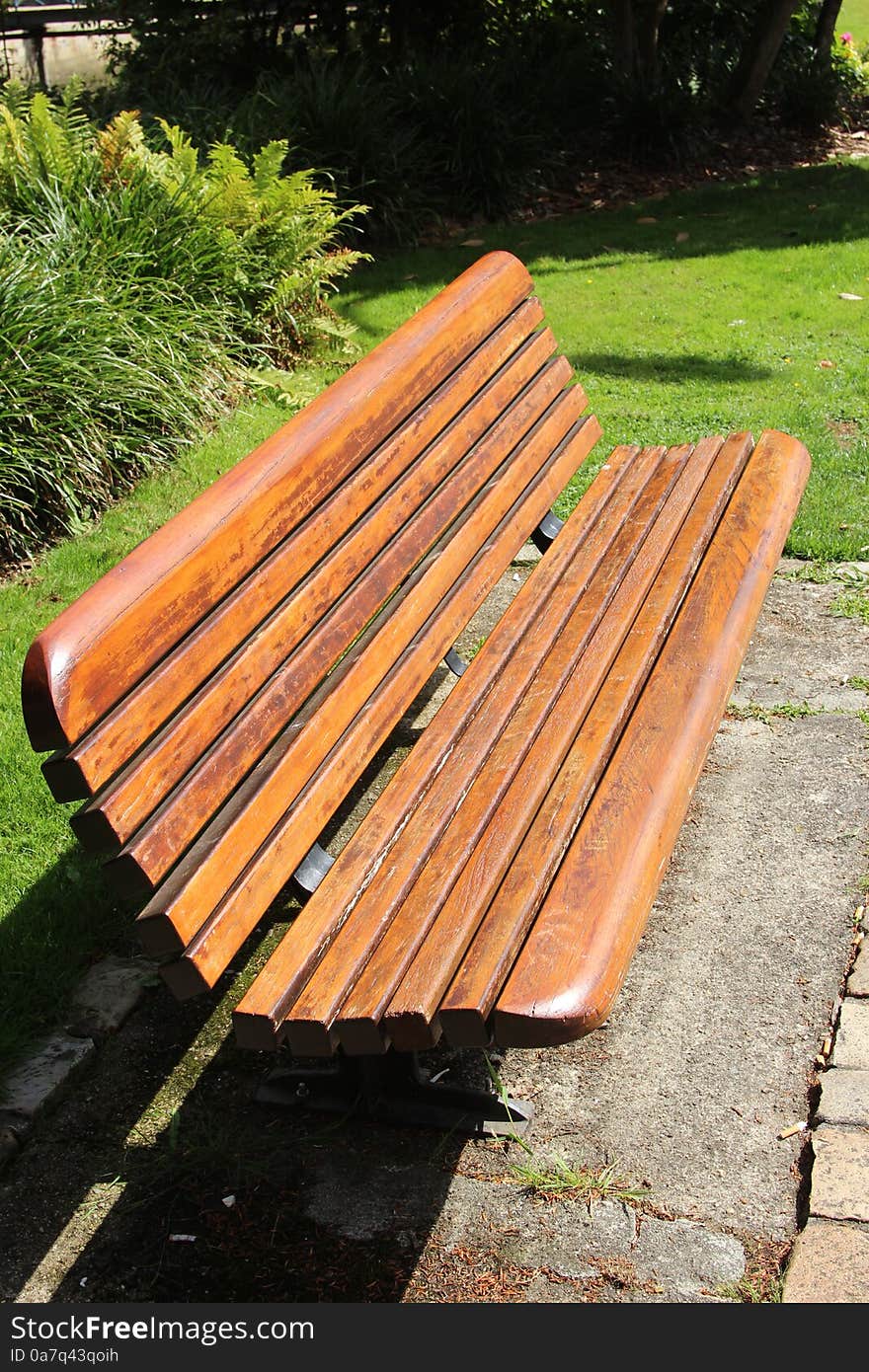 Beautiful wooden bench in riverside park in Quimper, Brittany, france