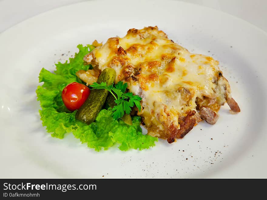 Meat casserole with tomatoes and cucumbers