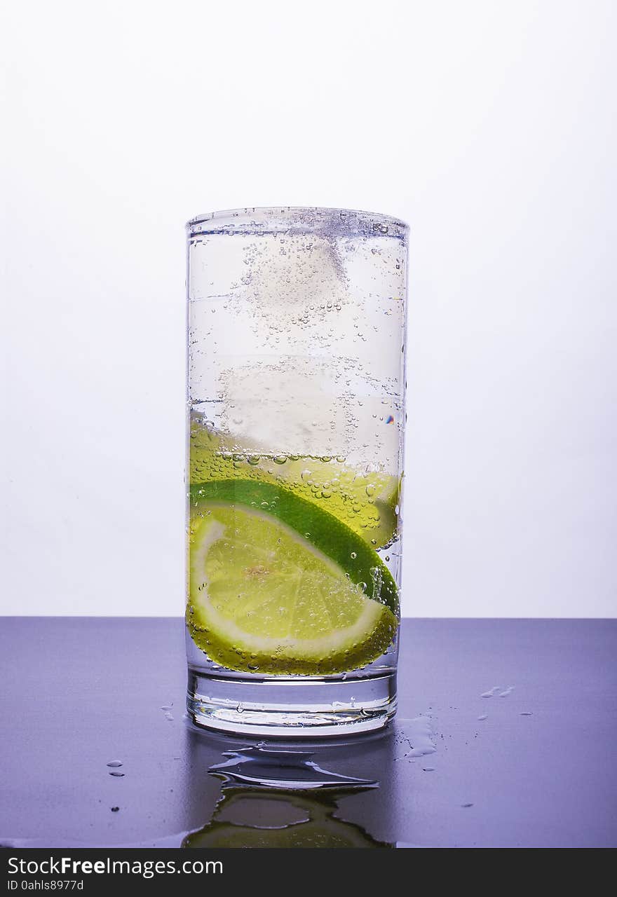 Soda with lemon and lime in the glass