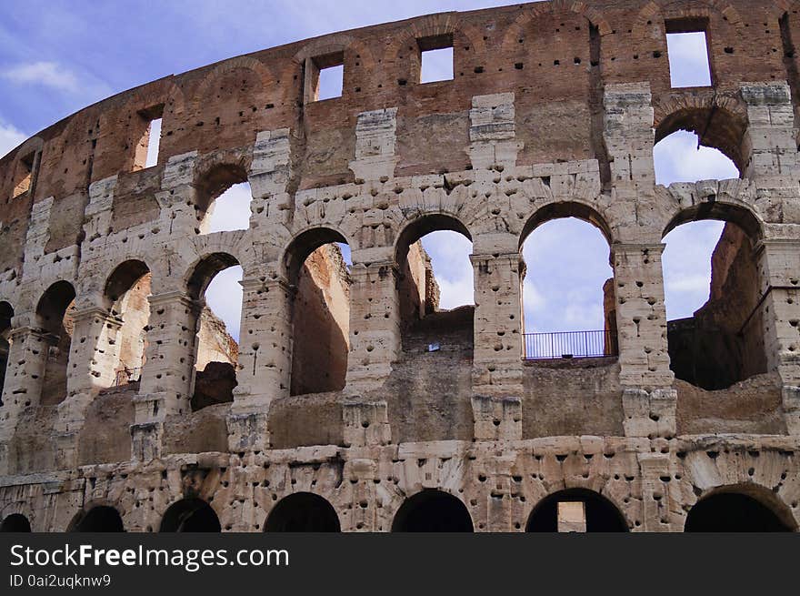 Wall Coliseum in a sunny day, blue sky arches windows Rome Italy. Wall Coliseum in a sunny day, blue sky arches windows Rome Italy