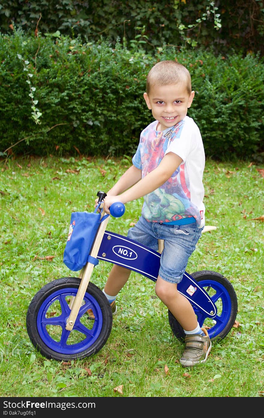 Cute Little Boy On A Bike