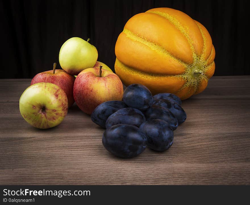 Melon,apples and plums of autumn still life