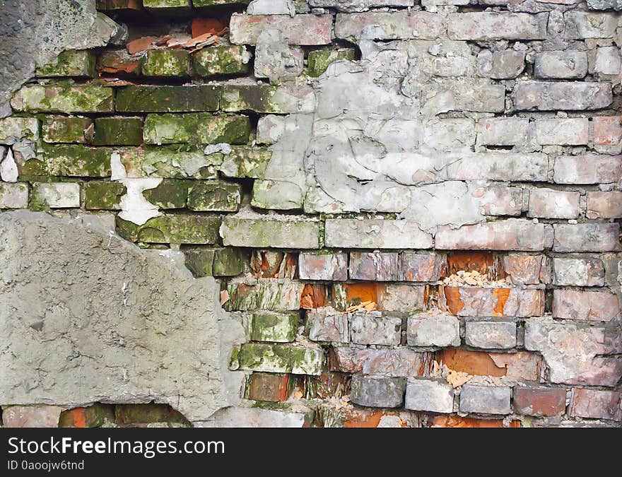 Old crumbling brick wall outside. Old crumbling brick wall outside