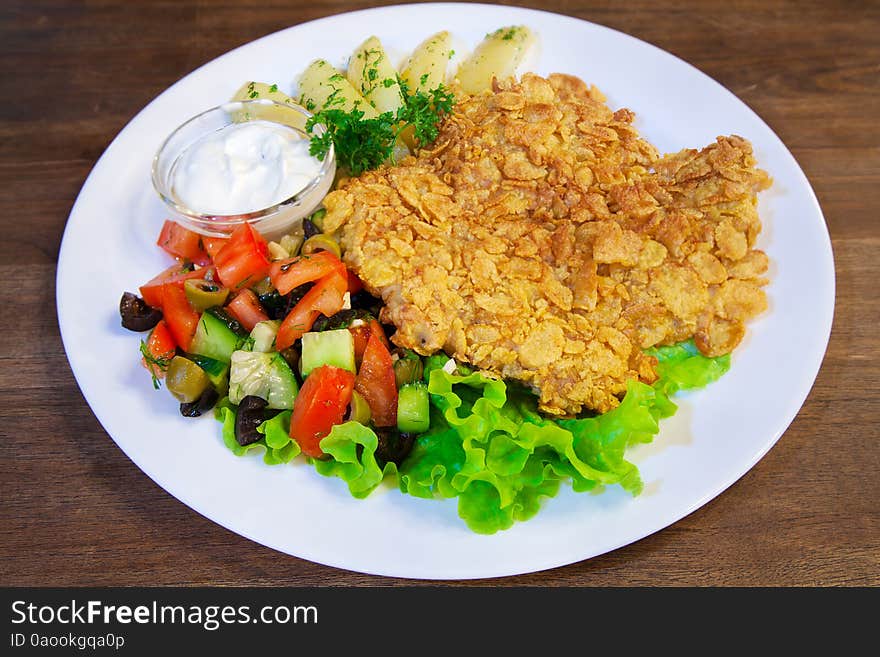 Meat casserole with vegetables on a plate