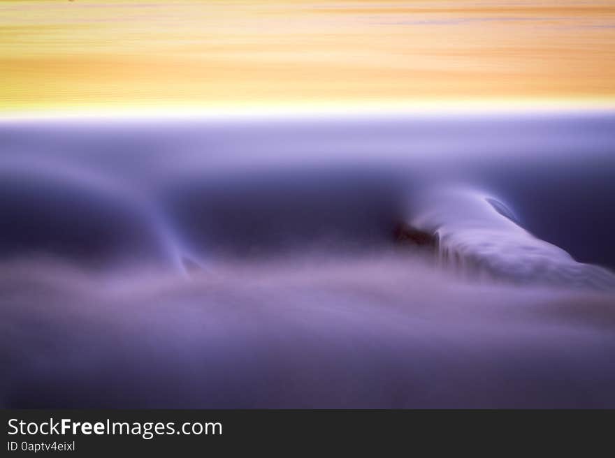 An abstract detail of water flowing over a dam. An abstract detail of water flowing over a dam.