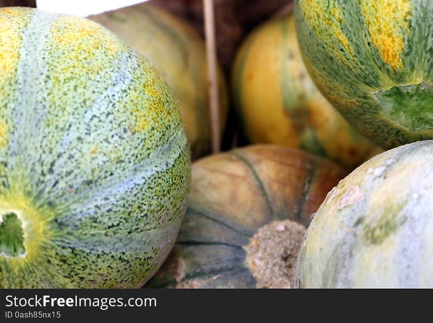 Personal size watermelons in produce display at local farmer's market