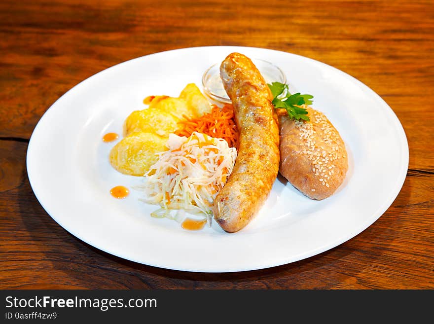 Sausages With Vegetables On A Plate