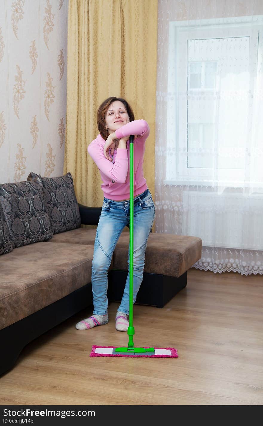 Young Brunette Woman Standing With Mop