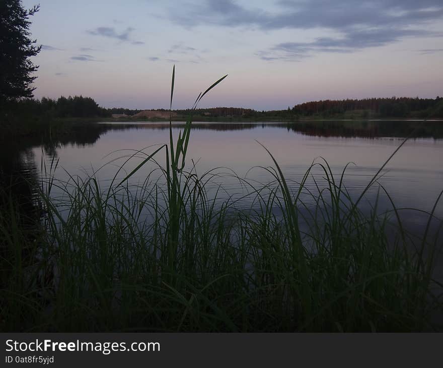 The late evening sunset over the lake in the summer