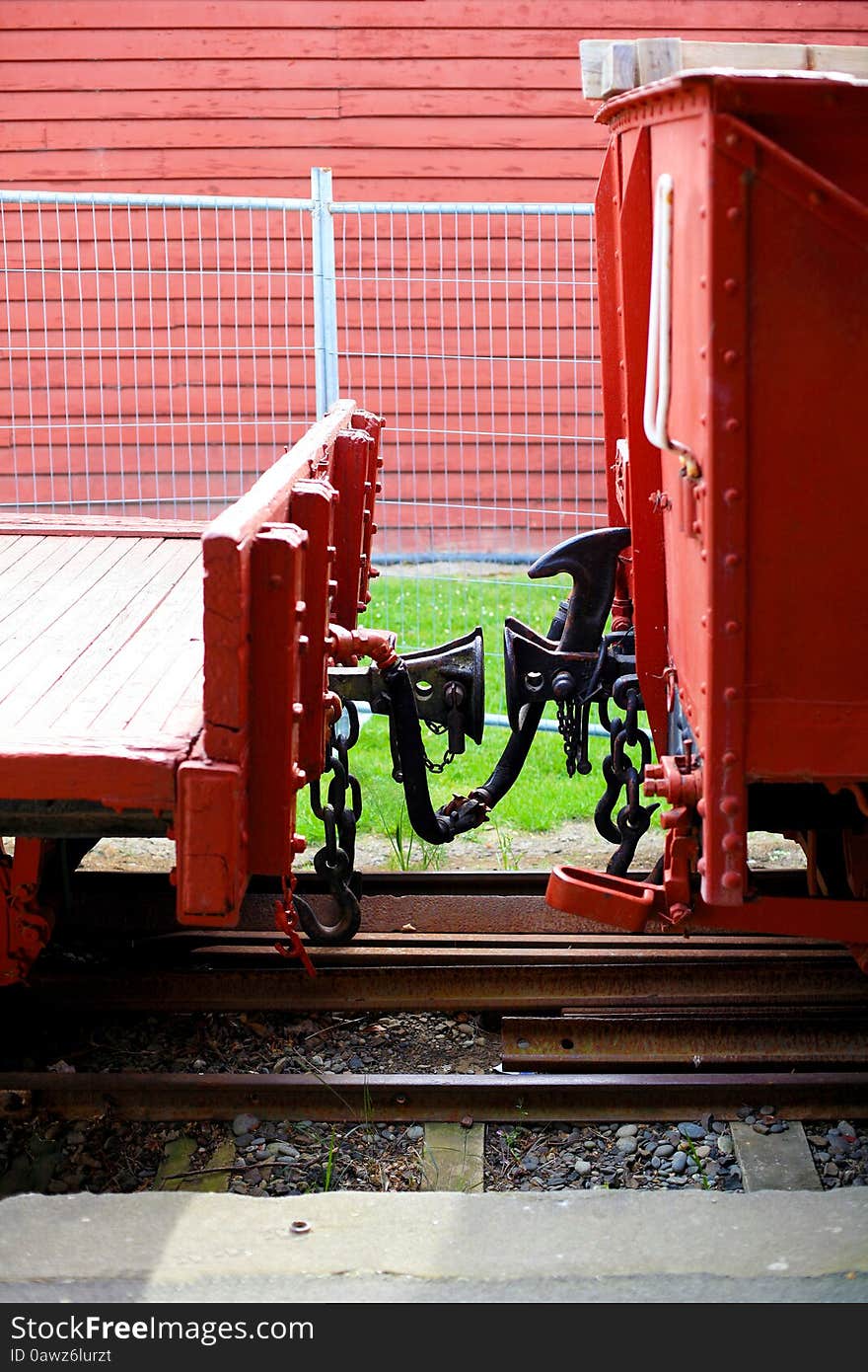 Manual car coupling of an old train in Little River, New Zealand