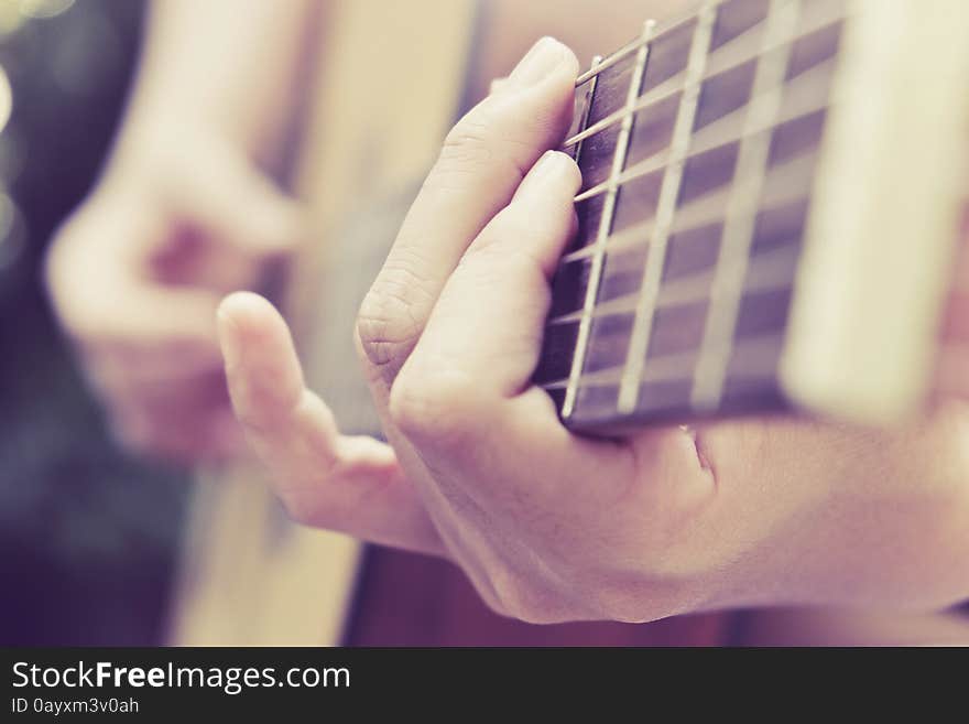 Close up image of Man playing his acoustic guitar Background. Close up image of Man playing his acoustic guitar Background