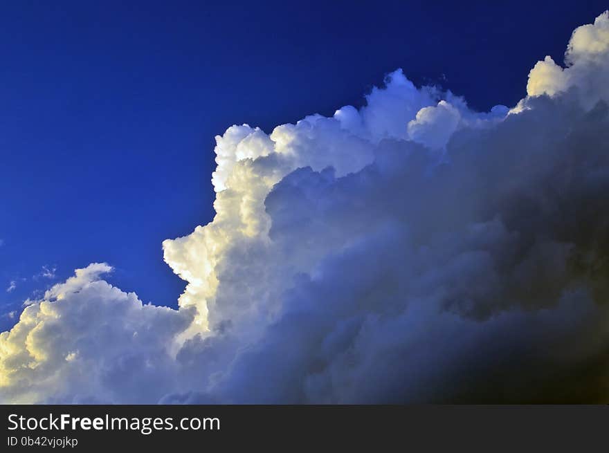 Sunlight highlighting storm clouds