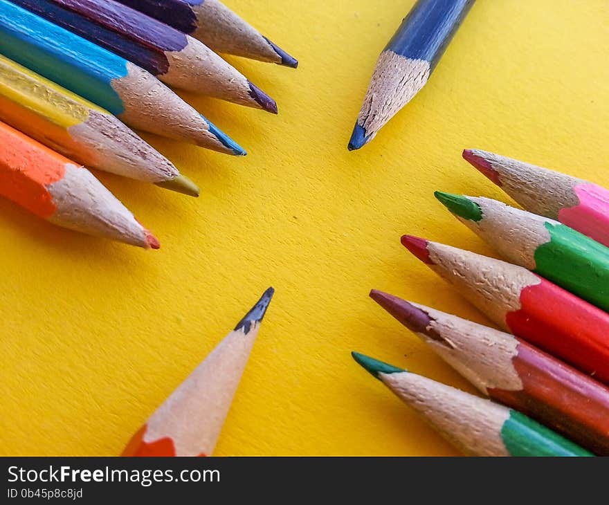 Picture with variety drawing crayon on yellow table. Picture with variety drawing crayon on yellow table