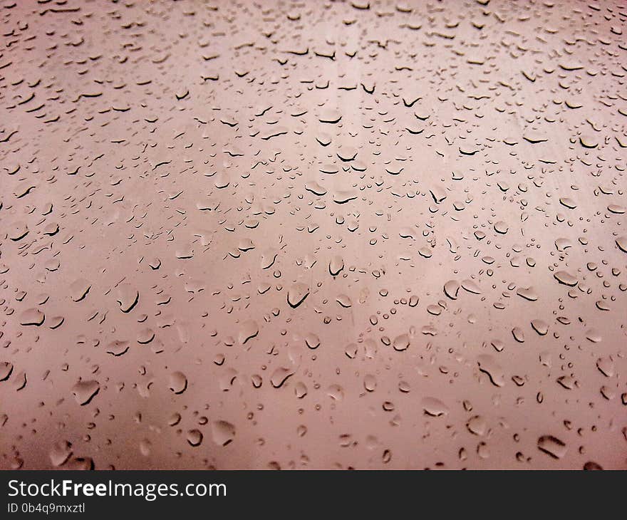 Textured condensation on the brown glass