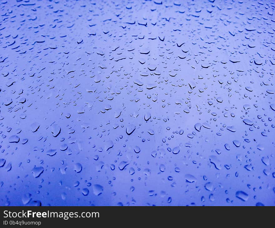 Background with water drops on the blue window. Background with water drops on the blue window